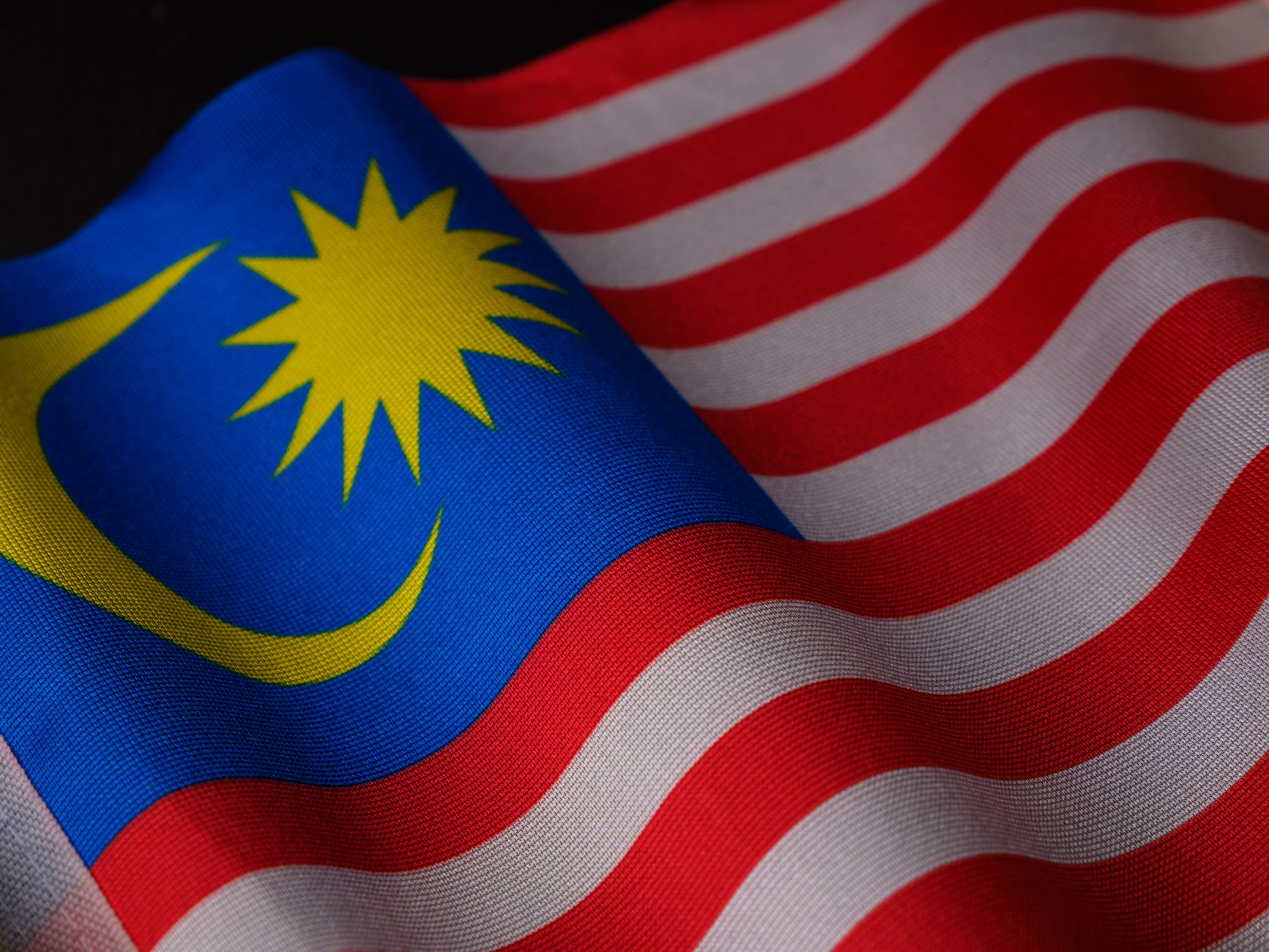 a close up shot of the flag of malaysia